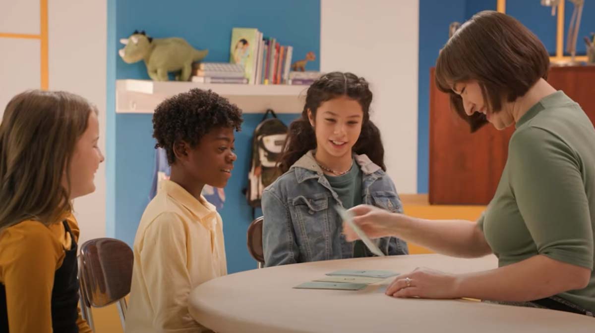 Teacher teaching students in reading exercise