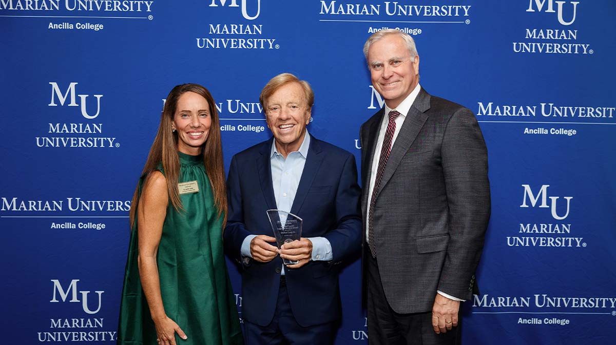 Marian University officials posing for photo