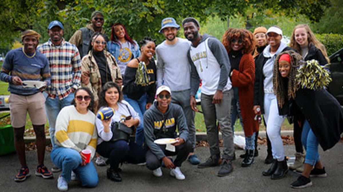 A diverse group of students posing for a photo