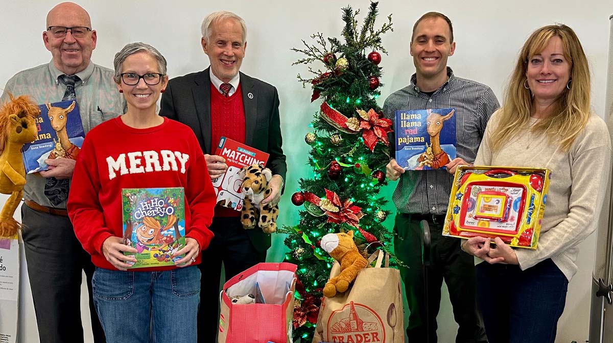 Donors posing with gifts for Salvation Army