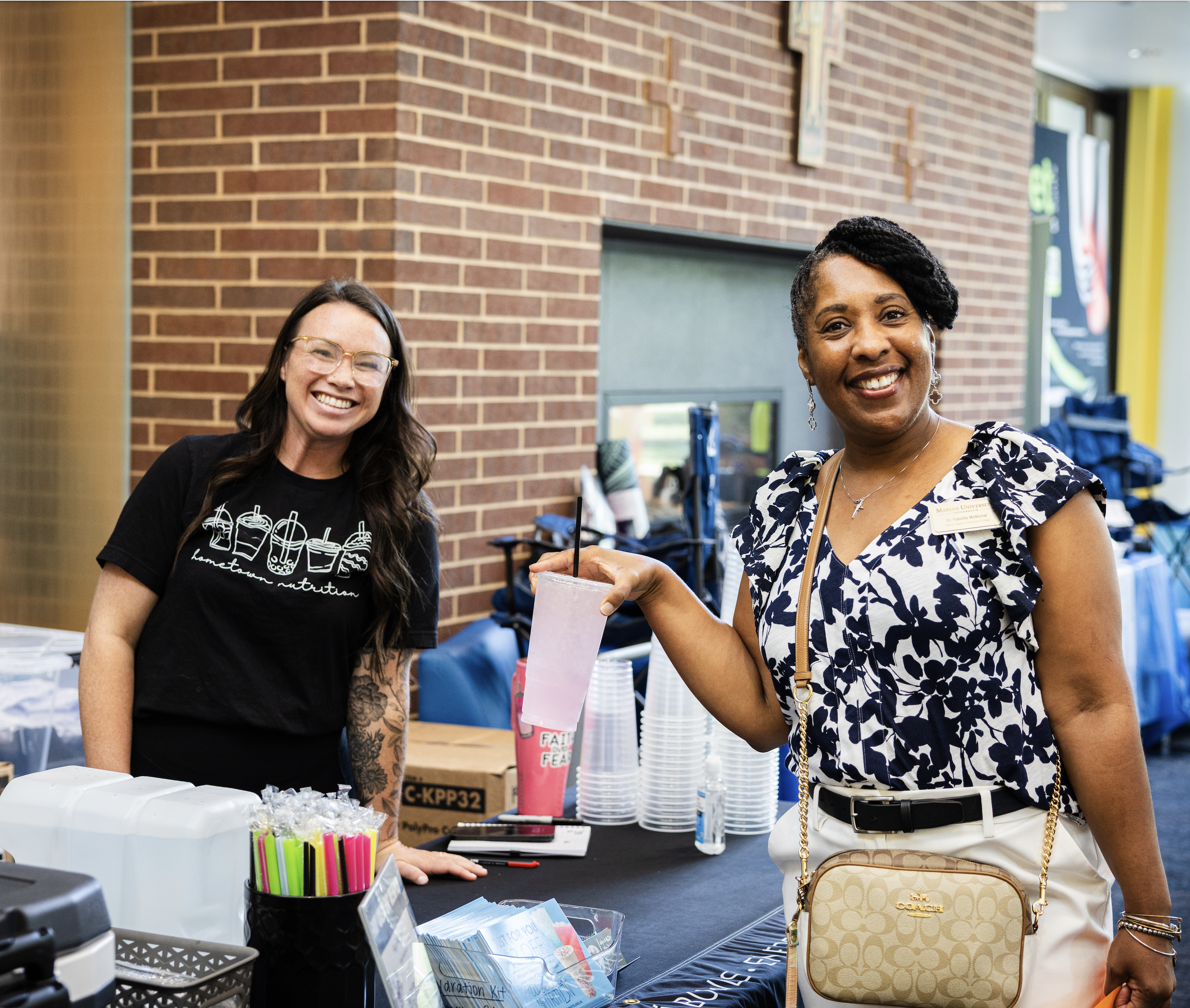 Two attendees of the health fair posing for a photo