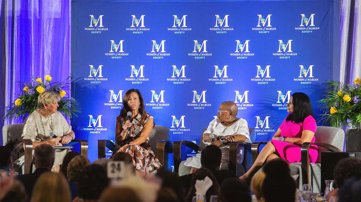 Panel discussion featuring four speakers at the Women's African American Society event.