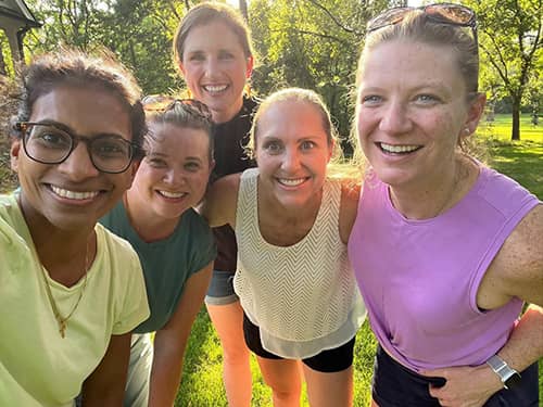 Group photo of Dr. Solik and students after a run