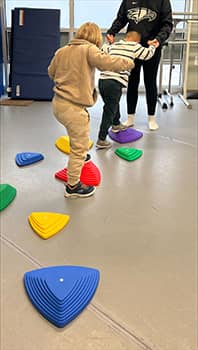 Two children at play in OT
