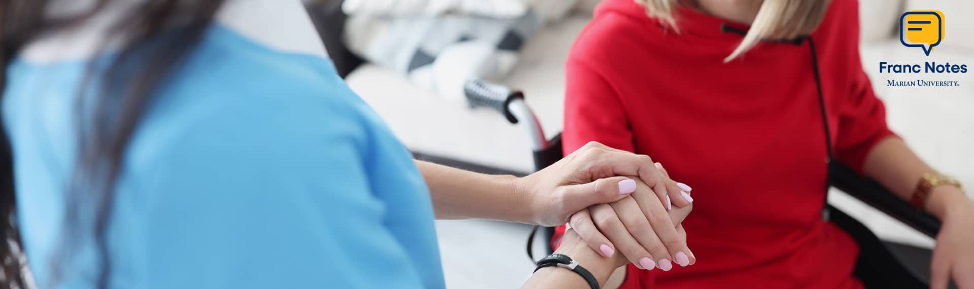 What is OT hero image of two people grasping hands in healthcare setting