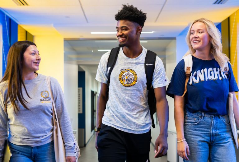 Students walking together down hallway