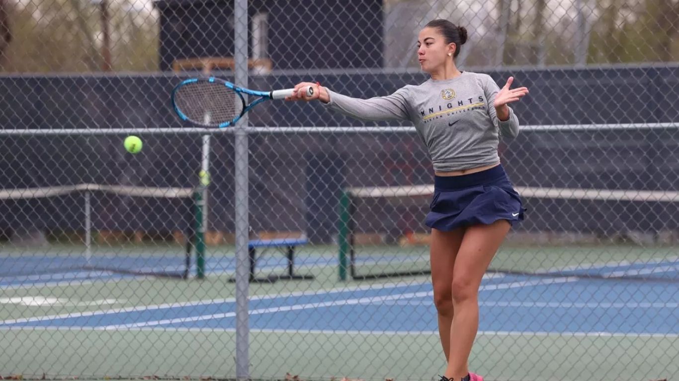 Student playing tennis