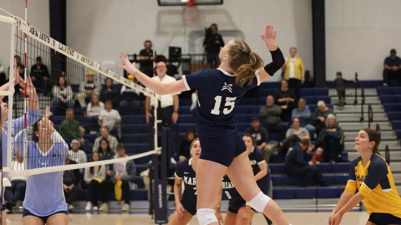 Female student playing volleyball