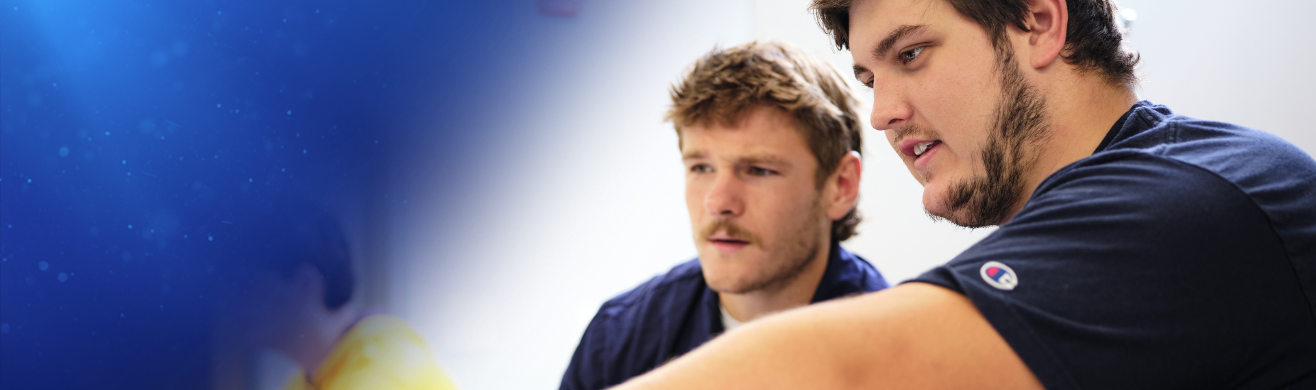 Business students working on laptop