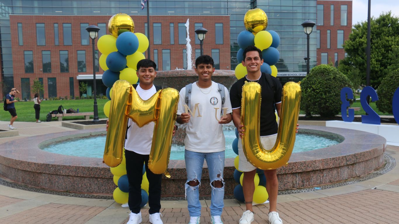 Students holding balloons