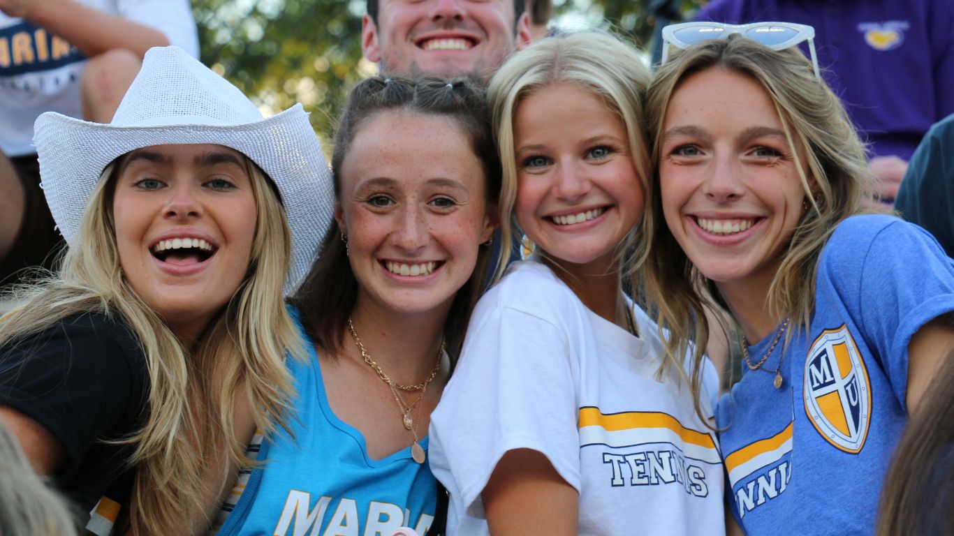 Students smiling together in group photo