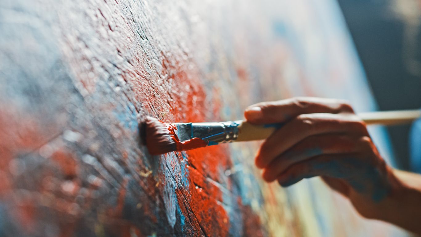 Student painting on canvas