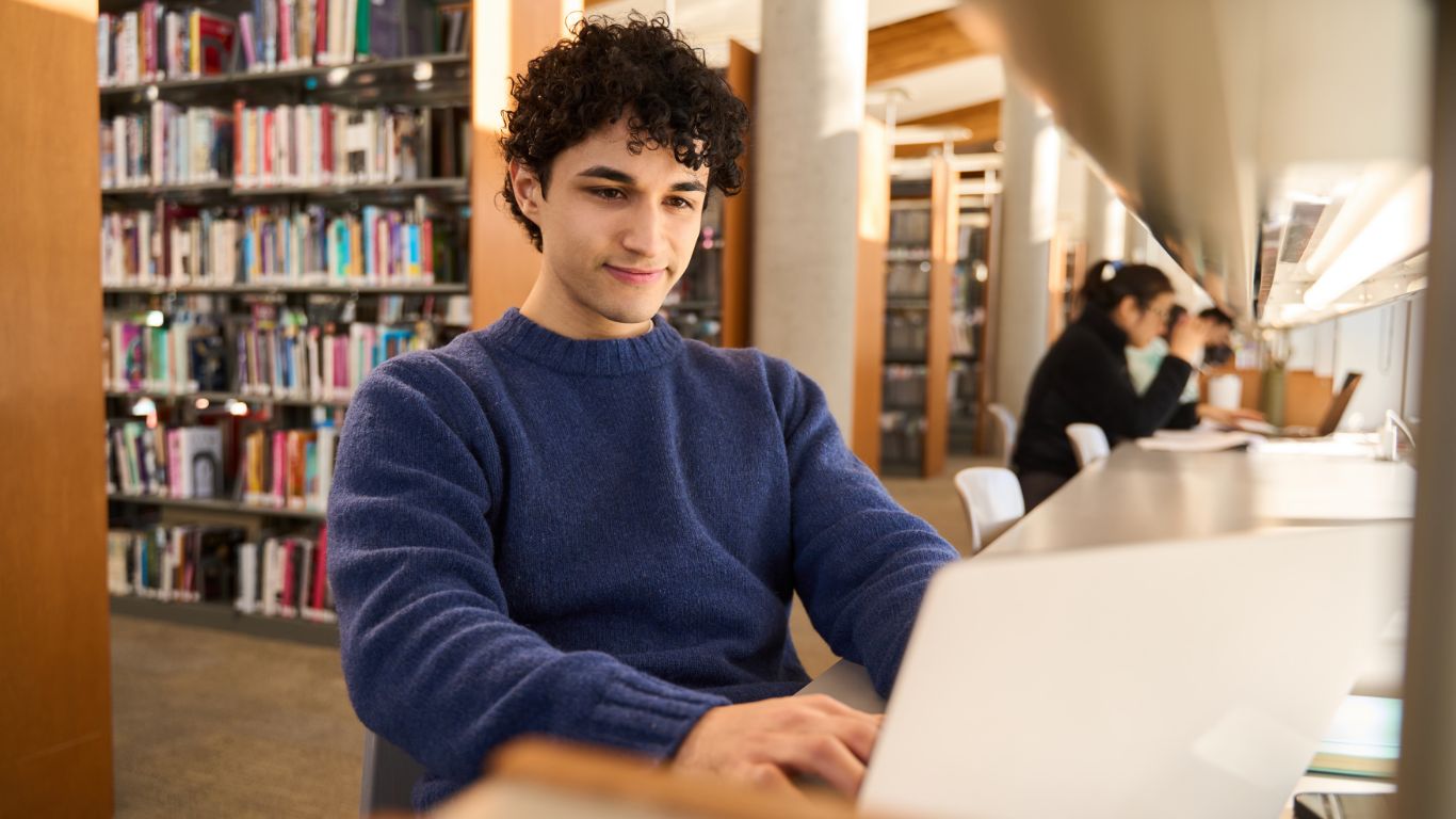 Student on computer in library