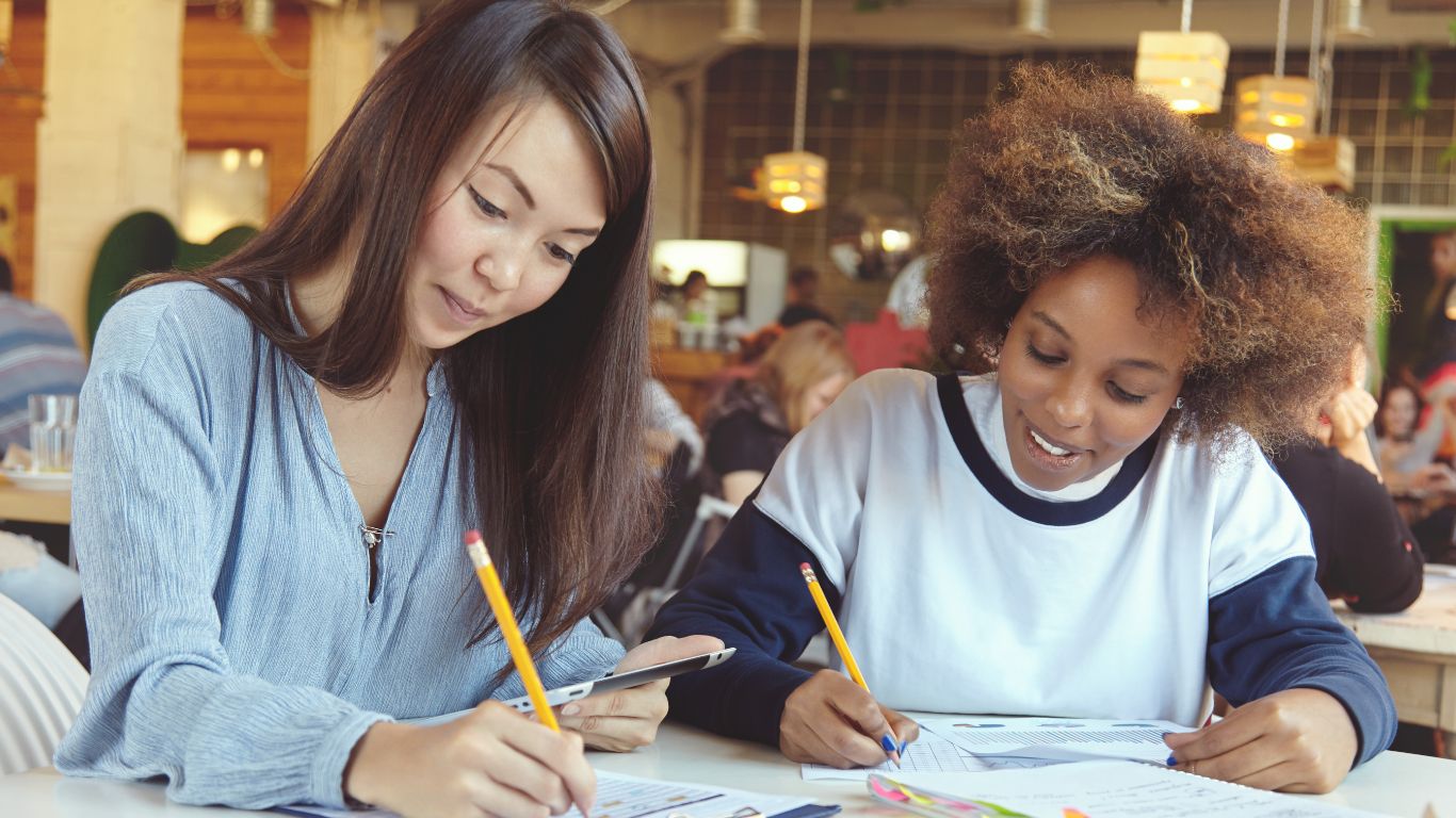 Students writing in notebook