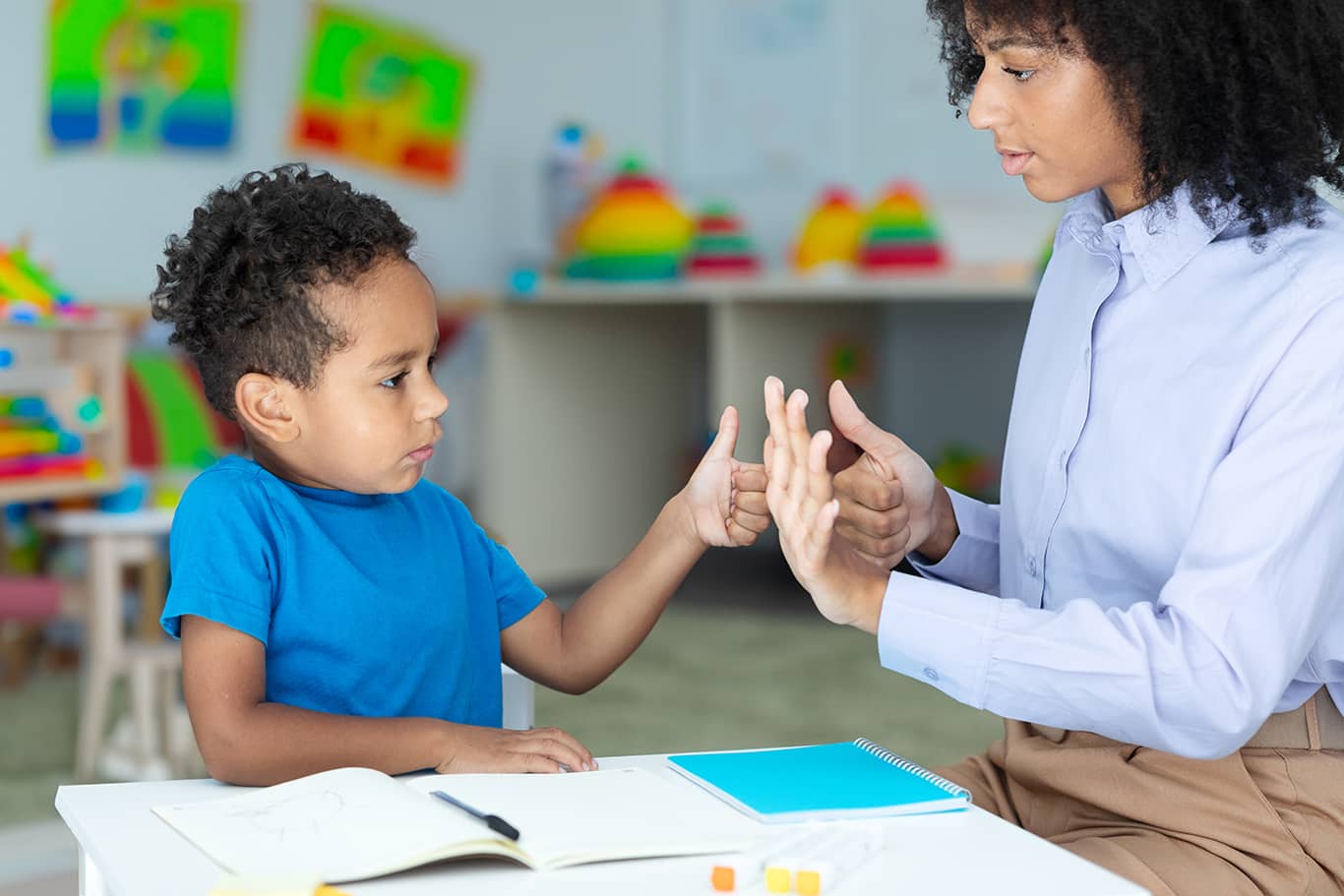 Student with child teaching how to count