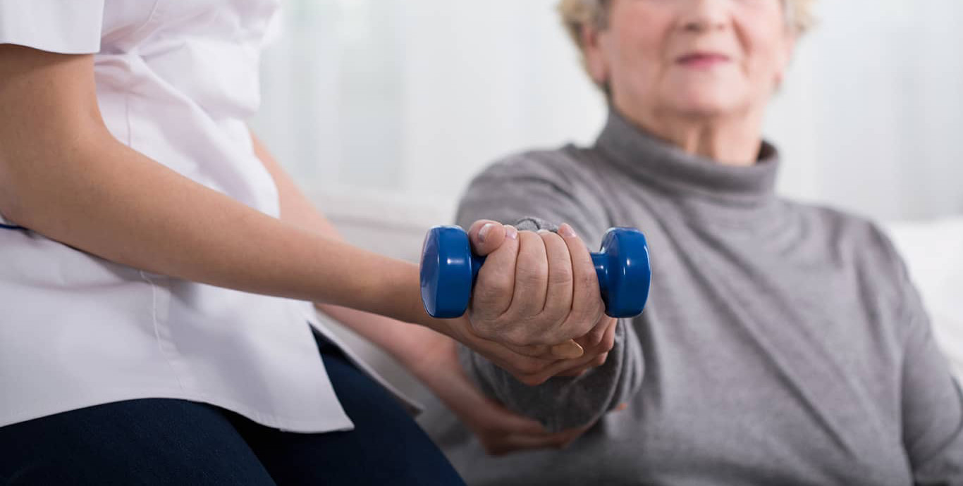 Old woman holding weight