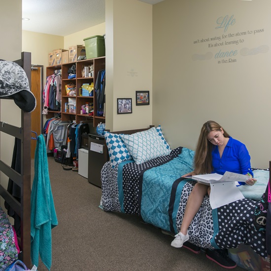 MUAC Student Studying in their Dorm Room