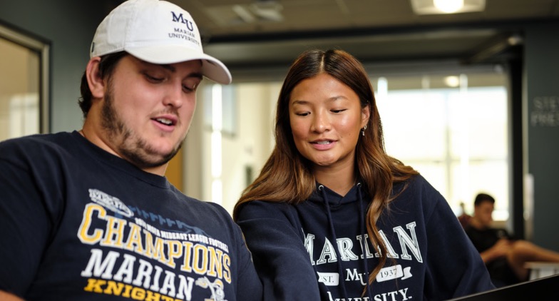 Marian students studying