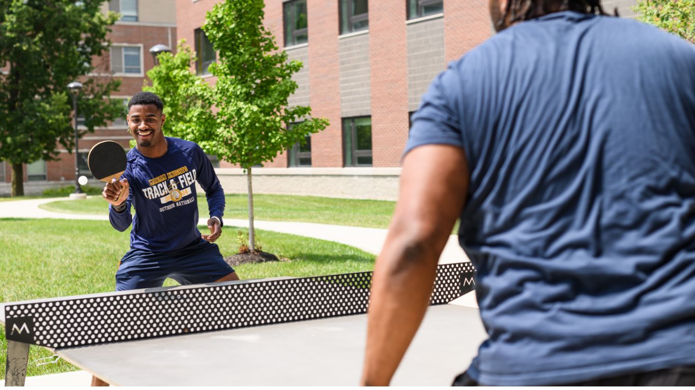 Students playing ping pong