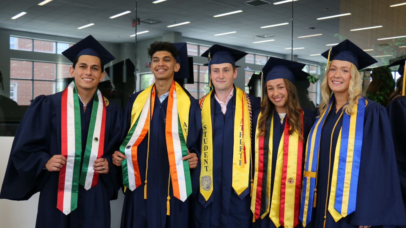 International students wearing graduation attire