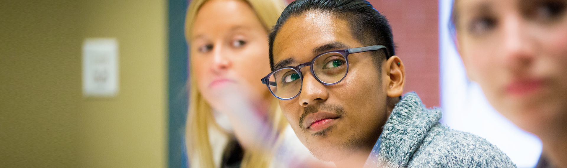 students looking at the professor