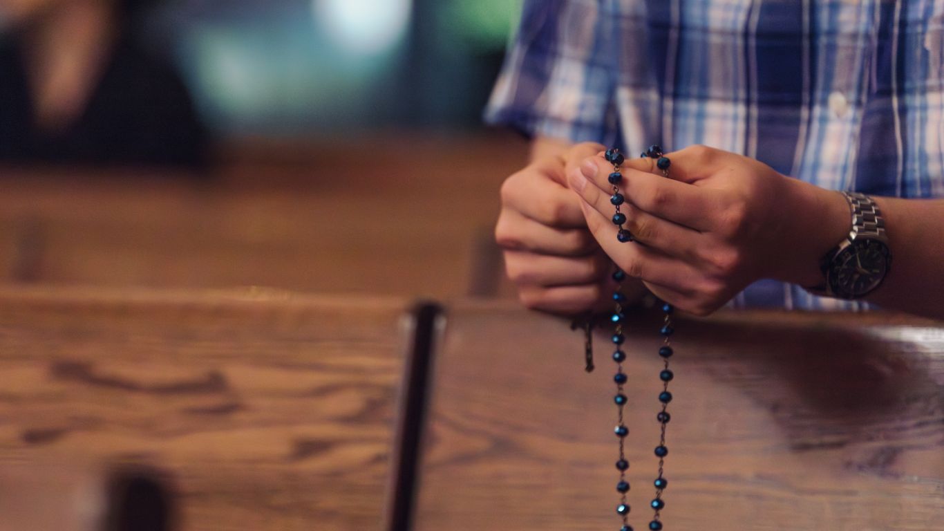 Student holding a rosary