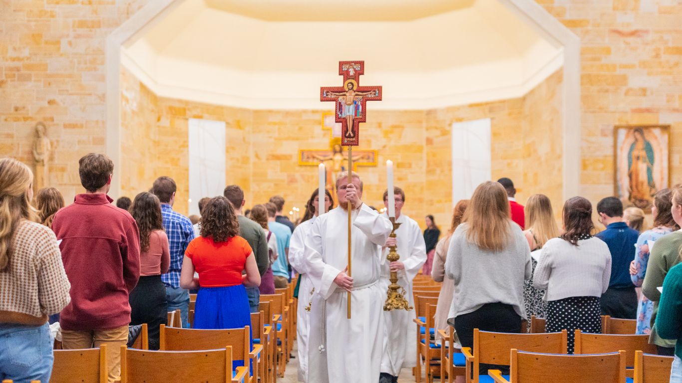 Students participating in a campus Mass