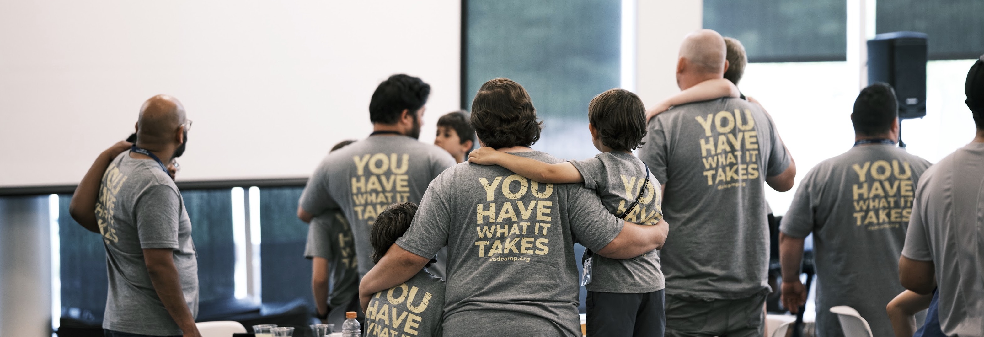 Dads and sons in matching shirts