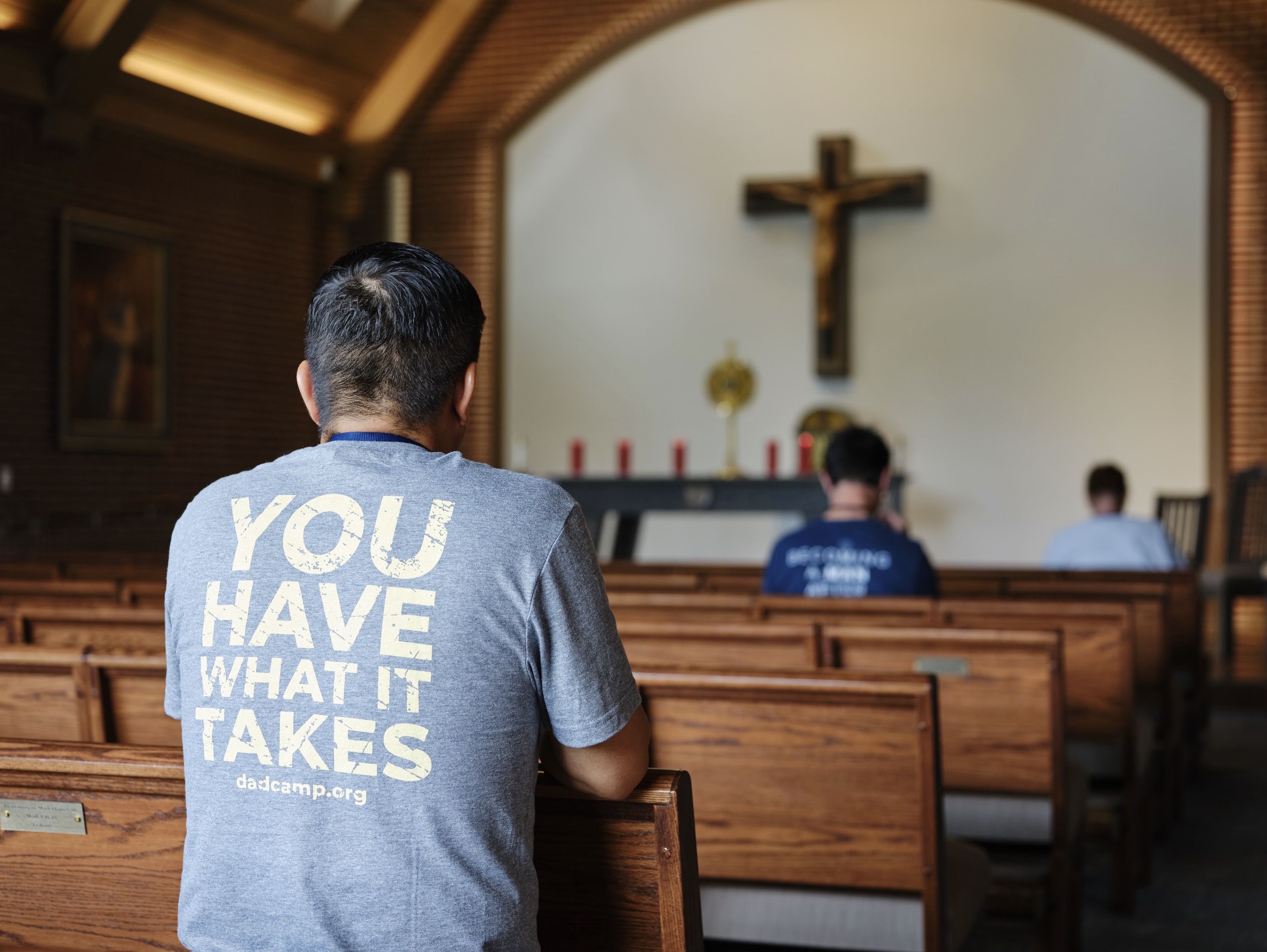 A father praying in the chapel