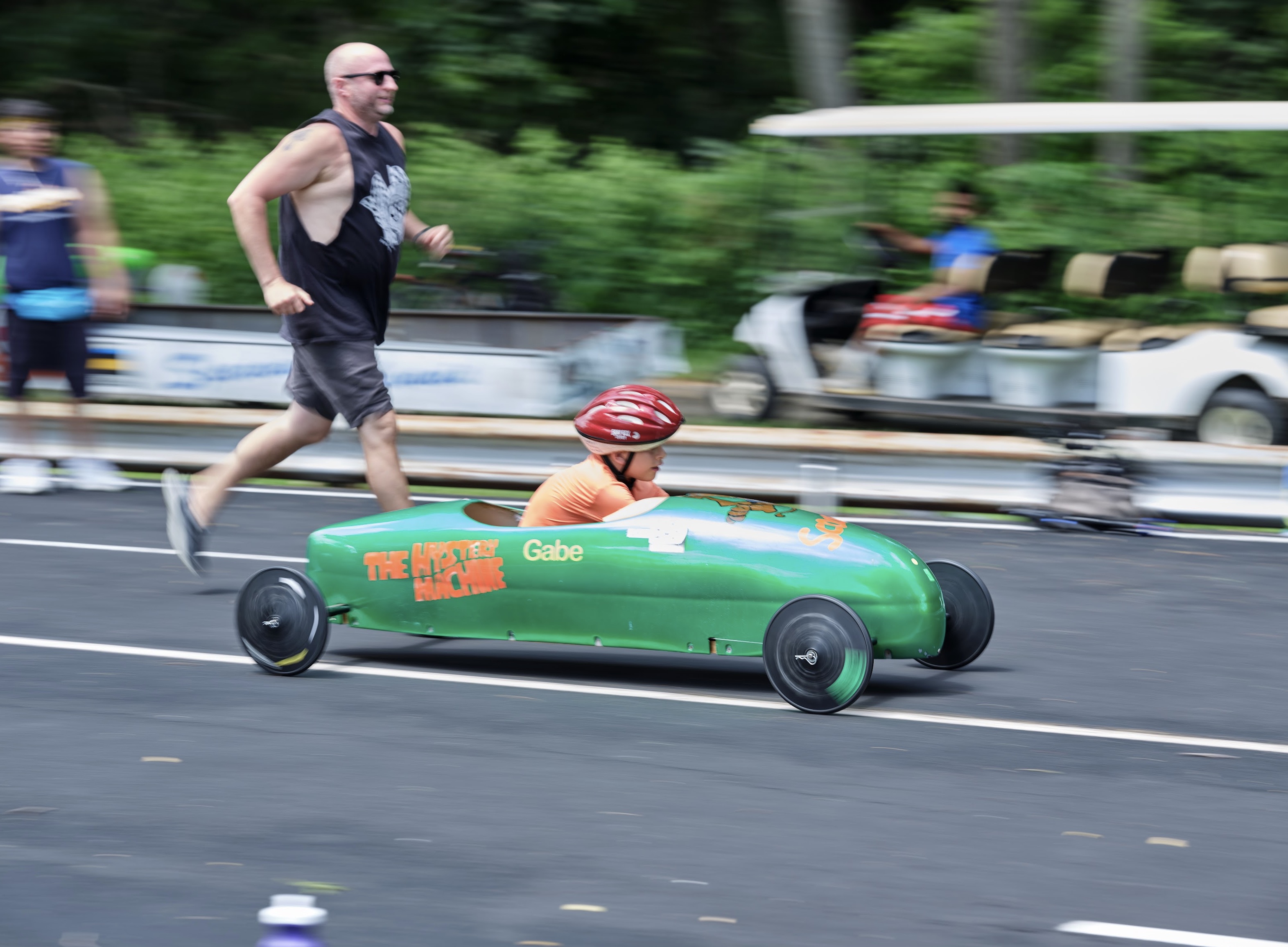 Father and son doing derby cars