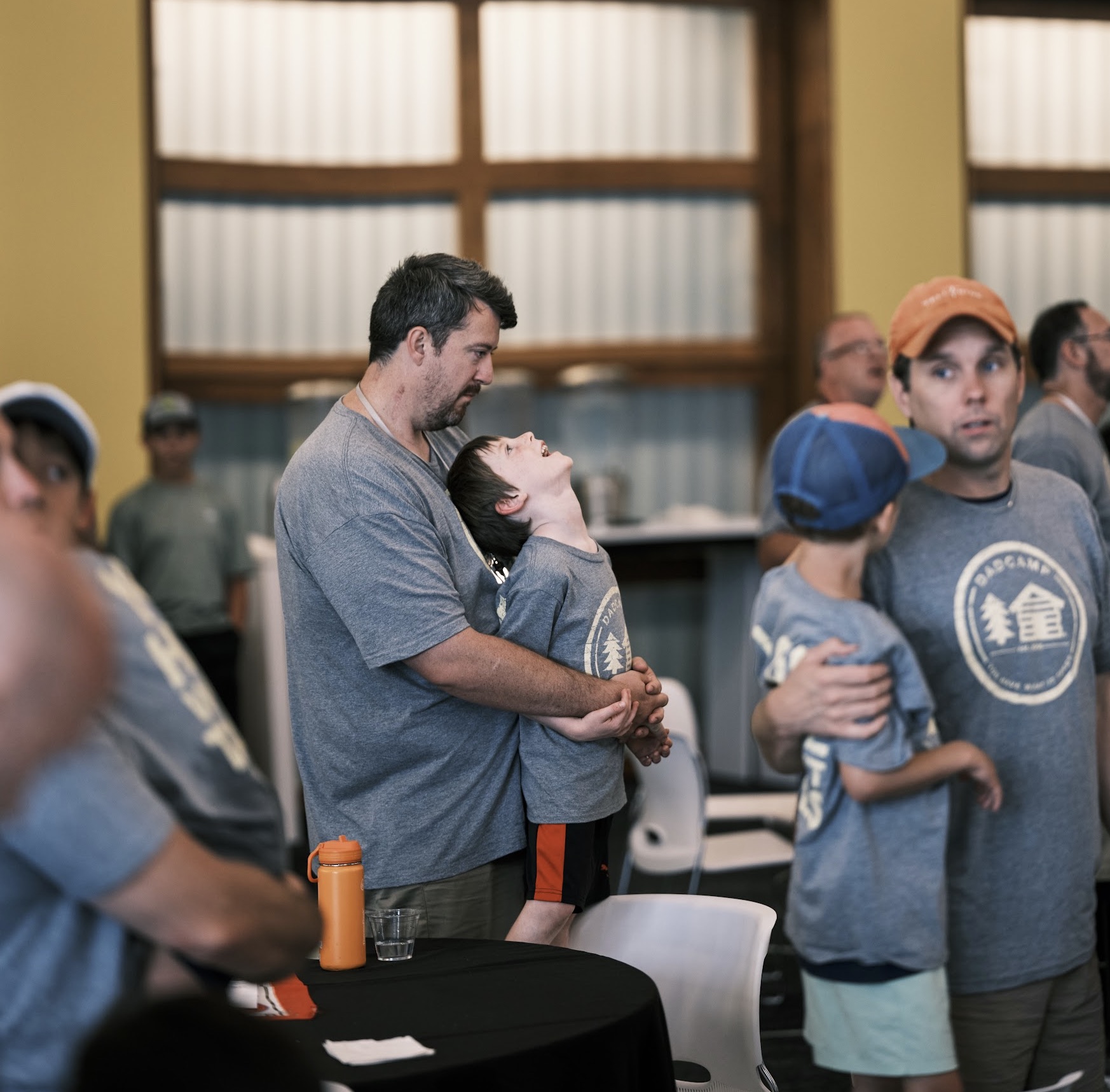 Father and son in alumni hall