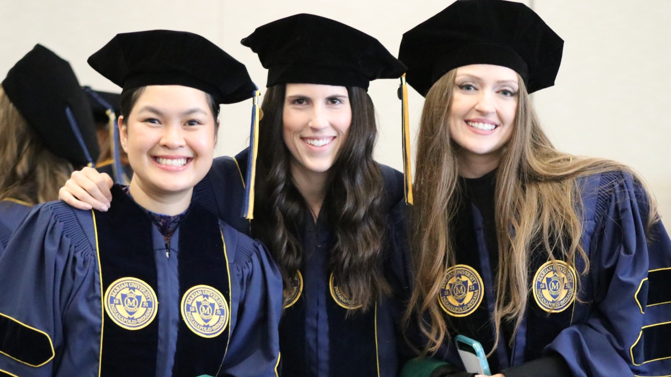 Students in gowns at graduation