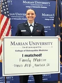 Student doctor Emily Yocom holding Match Day announcement