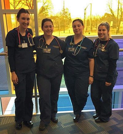 Nursing students Rachel Cross, Casey Revadelo, Olivia Schuh, and Mikayla Boller