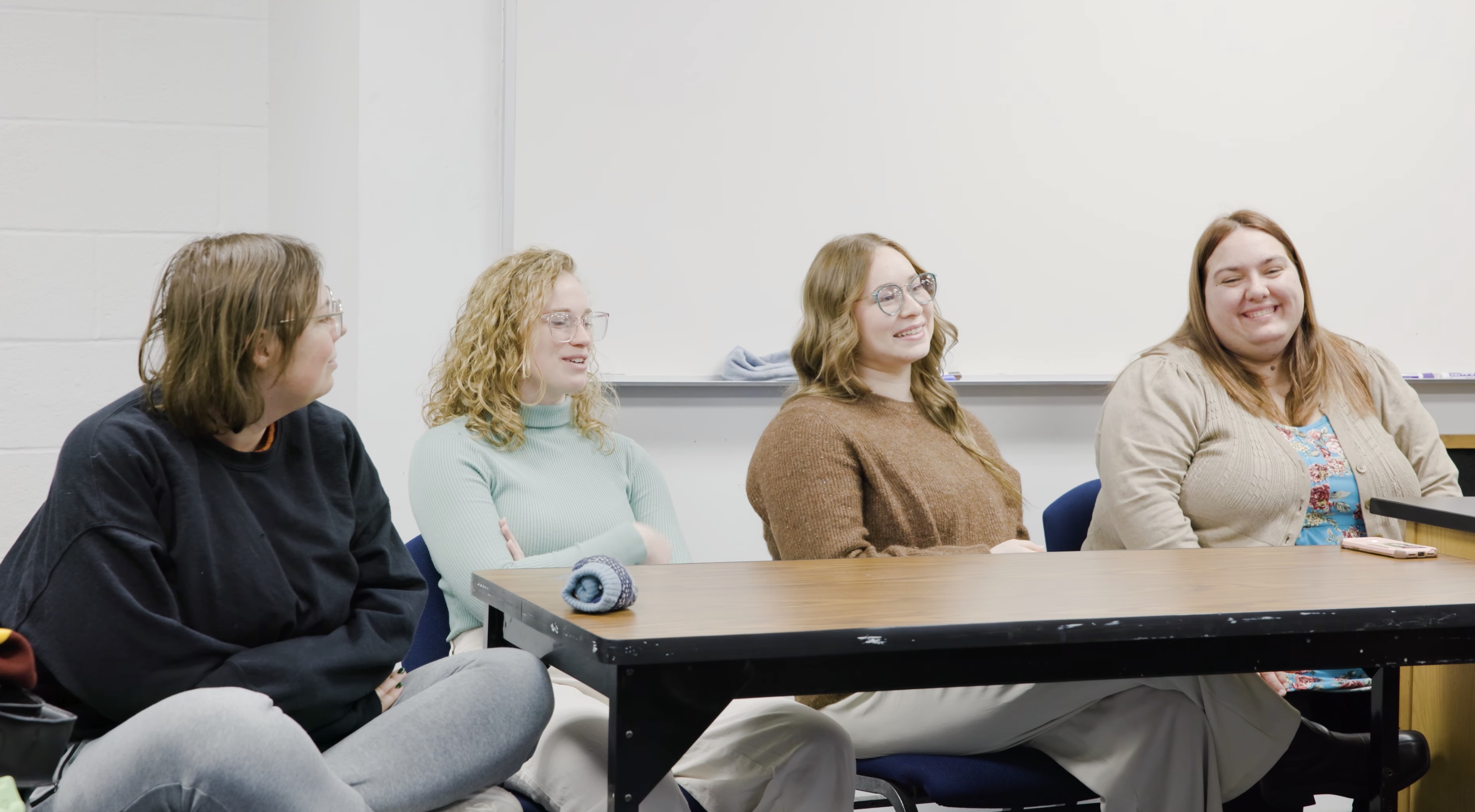 Social work students talking in a classroom