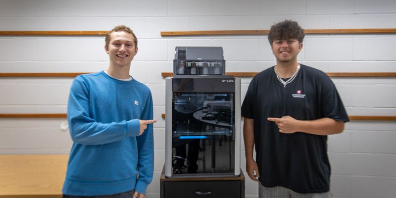 Two students with the 3D Printer