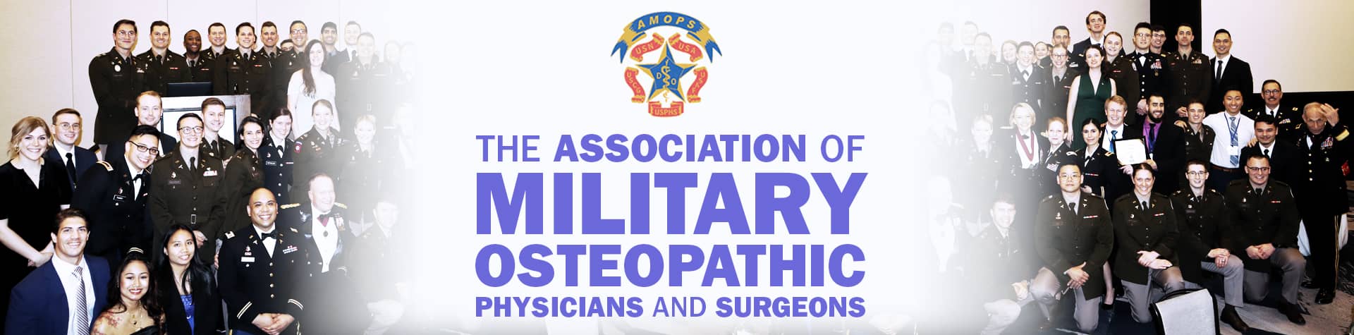 Group photo of AMOPS conference attendees in military uniforms with AMOPS logo