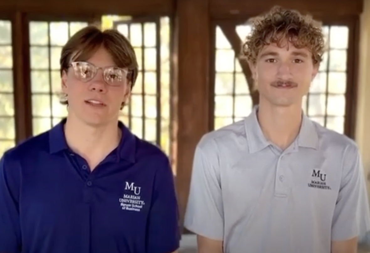 Two professional selling students talking to the camera
